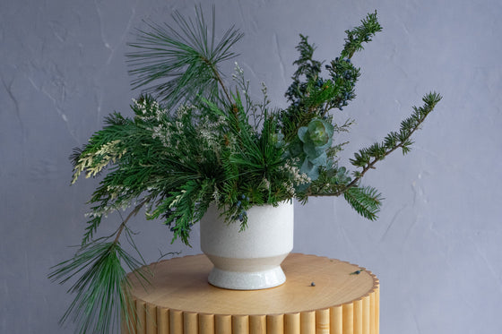 Evergreens Arranged in a Vase